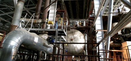 Equipment, cables and piping as found inside of a modern industrial power plant