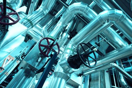 Equipment, cables and piping as found inside of a modern industrial power plantの写真素材
