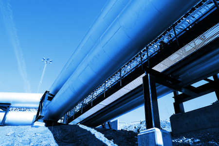 Industrial zone, Steel pipelines and valves against blue skyの写真素材