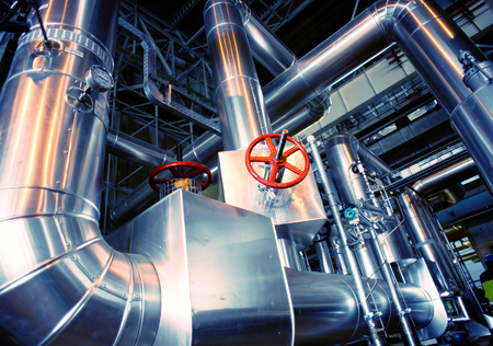 Equipment, cables and piping as found inside of a modern industrial power plant