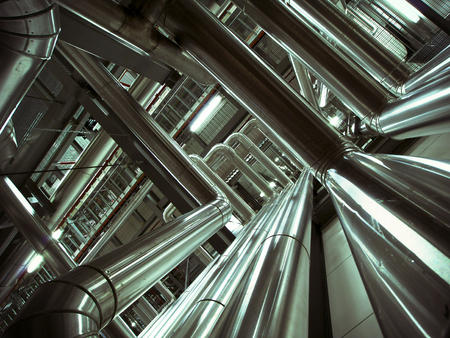 Equipment, cables and piping as found inside of a modern industrial power plantの写真素材