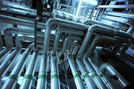Equipment, cables and piping as found inside of a modern industrial power plant