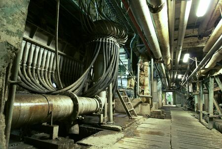 Equipment, cables and piping as found inside of a industrial power plantの写真素材