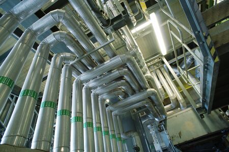 Equipment, cables and piping as found inside of a industrial power plant