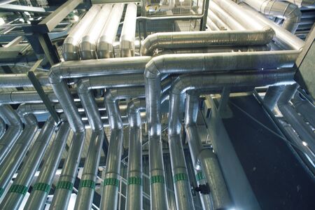 Equipment, cables and piping as found inside of a industrial power plant