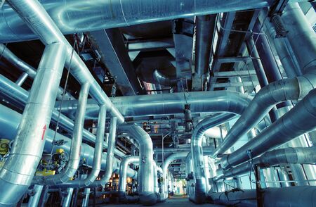 Equipment, cables and piping as found inside of a industrial power plant
