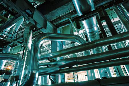 Equipment, cables and piping as found inside of a industrial power plant