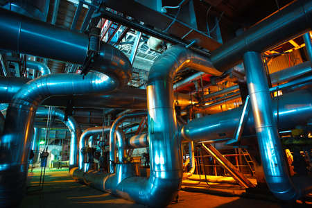 Equipment, cables and piping as found inside of a modern industrial power plant