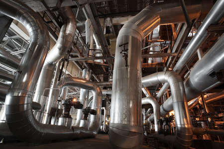 different size and shaped pipes and valves at a power plantのeditorial素材