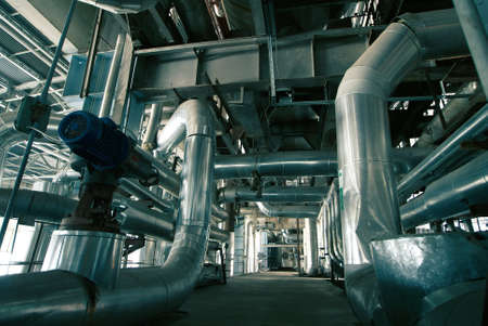 Equipment, cables and piping as found inside of a modern industrial power plant