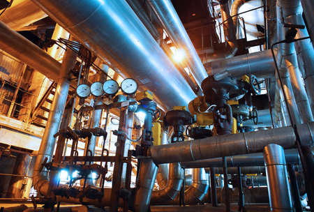 Equipment, cables and piping as found inside of a industrial power plantのeditorial素材
