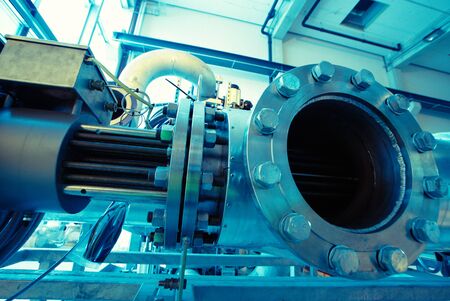 different size and shaped pipes and valves at a power plantのeditorial素材