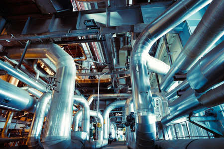 Equipment, cables and piping as found inside of a modern industrial power plant