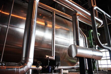 different size and shaped pipes and valves at a power plantのeditorial素材