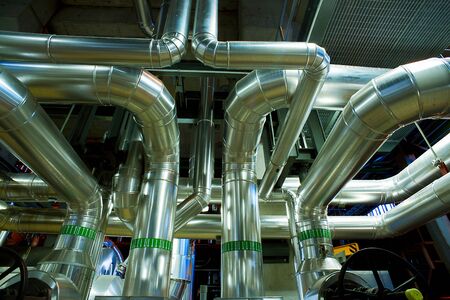 Equipment, cables and piping as found inside of a modern industrial power plantの写真素材