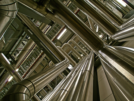 ifferent size and shaped pipes and valves at a power plant