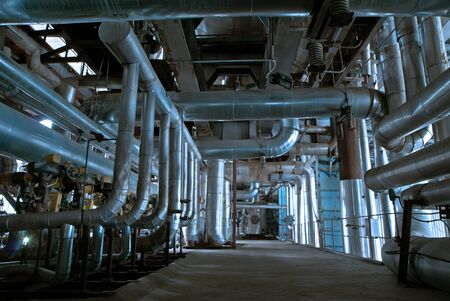 Equipment, cables and piping as found inside of a modern industrial power plantの写真素材