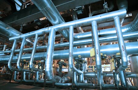 Equipment, cables and piping as found inside of a modern industrial power plant