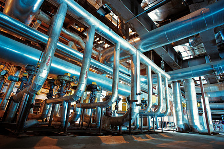 Equipment, cables and piping as found inside of a modern industrial power plant
