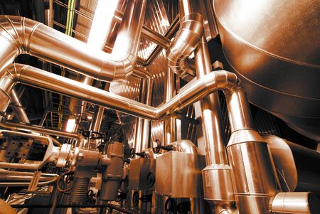 Equipment, cables and piping as found inside of a modern industrial power plant