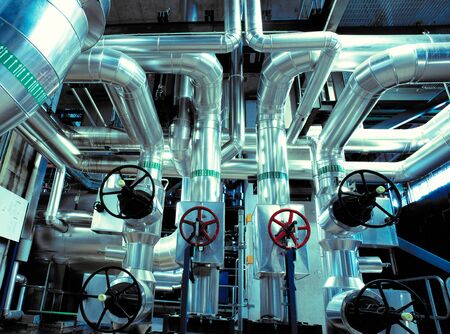 Equipment, cables and piping as found inside of a modern industrial power plant