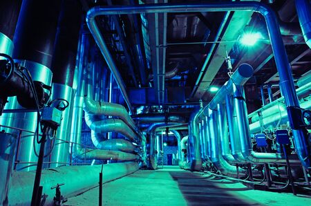 Equipment, cables and piping as found inside of a modern industrial power plantの写真素材