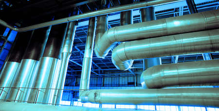 Equipment, cables and piping as found inside of a modern industrial power plant