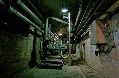 Old abandoned dirty empty scary factory interiorの写真素材