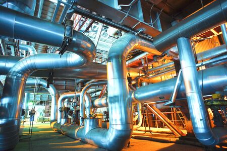 Equipment, cables and piping as found inside of a modern industrial power plant