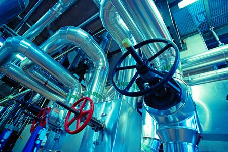 Equipment, cables and piping as found inside of a modern industrial power plant