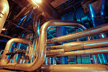 Equipment, cables and piping as found inside of a modern industrial power plantの写真素材