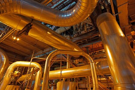 Equipment, cables and piping as found inside of a modern industrial power plant
