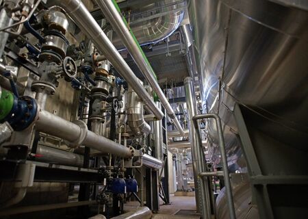 Equipment, cables and piping as found inside of a modern industrial power plantの写真素材