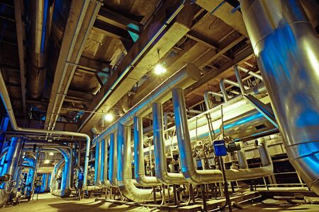 Equipment, cables and piping as found inside of a modern industrial power plant