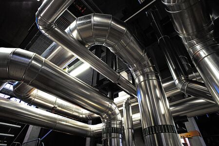 Equipment, cables and piping as found inside of a modern industrial power plant