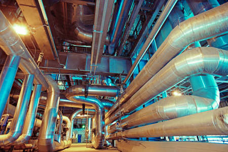 Equipment, cables and piping as found inside of a modern industrial power plant
