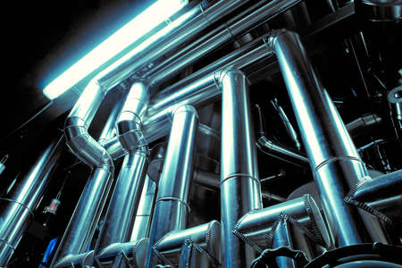 Equipment, cables and piping as found inside of a modern industrial power plantの写真素材