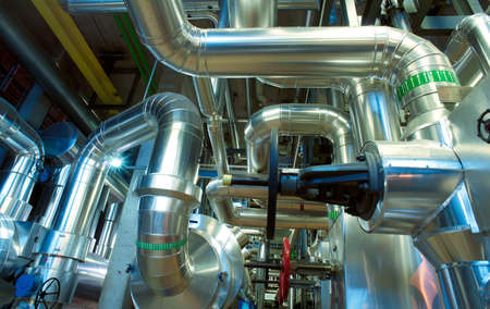 Equipment, cables and piping as found inside of a modern industrial power plantの写真素材