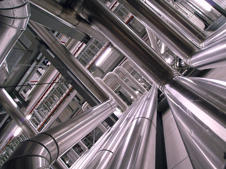 Equipment, cables and piping as found inside of a modern industrial power plant