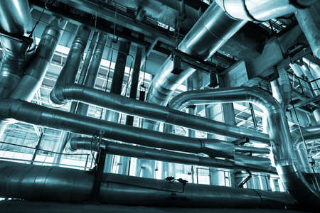Equipment, cables and piping as found inside of a modern industrial power plant