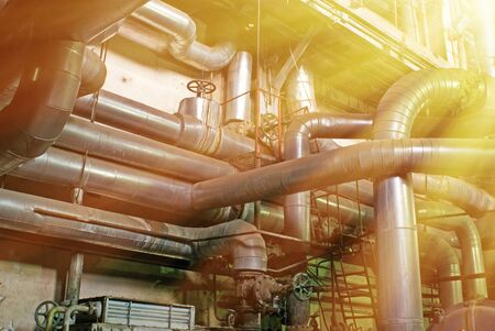 Equipment, cables and piping as found inside of a modern industrial power plant