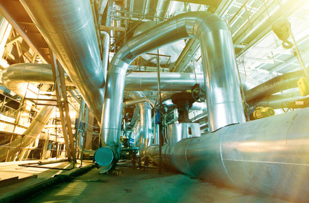 Equipment, cables and piping as found inside of a industrial power plant