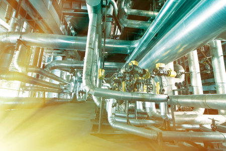 Equipment, cables and piping as found inside of a modern industrial power plant