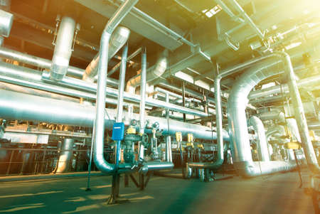 Equipment, cables and piping as found inside of a modern industrial power plant