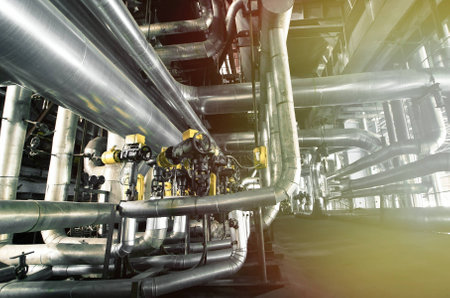 Equipment, cables and piping as found inside of a modern industrial power plant