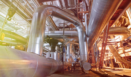 Equipment, cables and piping as found inside of a industrial power plant