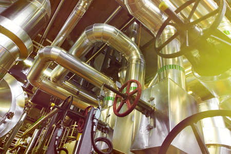 Equipment, cables and piping as found inside of a modern industrial power plantの写真素材