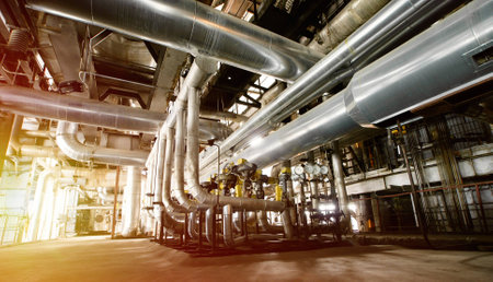 Equipment, cables and piping as found inside of a industrial power plant