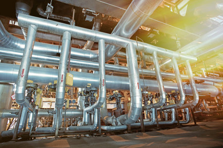 Equipment, cables and piping as found inside of a modern industrial power plant