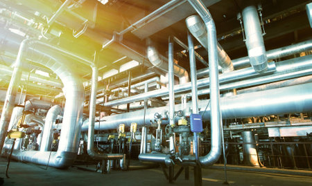Equipment, cables and piping as found inside of a modern industrial power plant